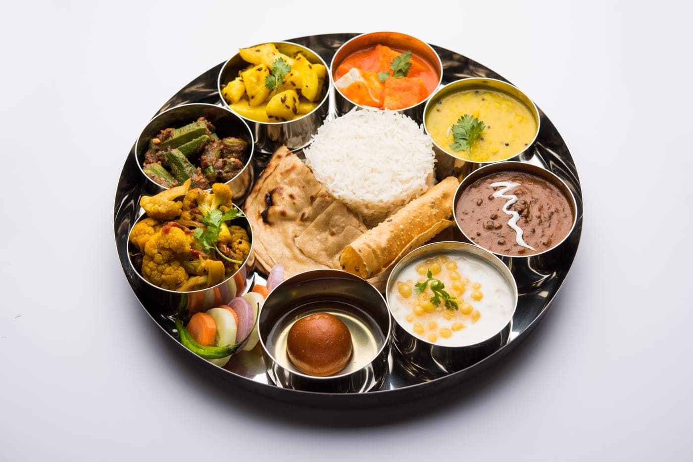 Special Thali: 5 ghee chapatis, 2 sabzis (1 paneer or premium), Dal tadka or dal makhani, Jeera rice or pulao, Salad, pickle & papad, Sweet of the day